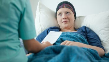 Doctor examining sick woman