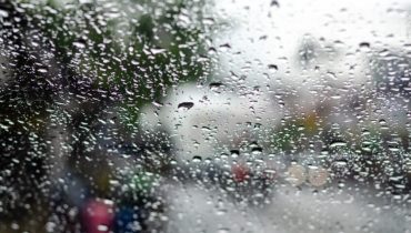 Raindrop on the car glass.