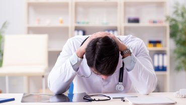 Young doctor sitting in the office